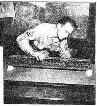 T/3 Owen Beckwith, Minneapolis, Minn., became so interested that he went to work on a scale model which he made out of cardboard, match sticks and glue.